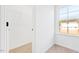 Bedroom featuring a window with natural light, carpet and a closet with wire shelving for optimal organization at 40 Rosewood Ln, Youngsville, NC 27596