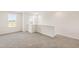 Upstairs loft area or bedroom with neutral carpet and natural light at 40 Rosewood Ln, Youngsville, NC 27596
