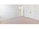 Bedroom featuring neutral carpet, white walls, doors to closets and an attached bathroom at 40 Rosewood Ln, Youngsville, NC 27596