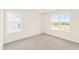 Bedroom with neutral carpet and lots of light coming through the windows at 40 Rosewood Ln, Youngsville, NC 27596