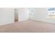 Bedroom with neutral carpet, white walls, and two windows for natural light at 40 Rosewood Ln, Youngsville, NC 27596