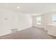 Spacious bedroom with neutral carpet, light-colored walls, and natural light at 40 Rosewood Ln, Youngsville, NC 27596