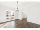 Dining room with hardwood floors, natural light, and traditional chandelier at 40 Rosewood Ln, Youngsville, NC 27596