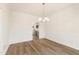 Formal dining room with wood flooring and stylish chandelier at 40 Rosewood Ln, Youngsville, NC 27596