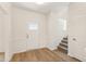 Bright foyer with wood floors and white trim, showcasing a welcoming entrance at 40 Rosewood Ln, Youngsville, NC 27596