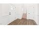 Bright foyer with hardwood floors, staircase and paneled walls at 40 Rosewood Ln, Youngsville, NC 27596