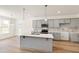 Spacious kitchen with gray cabinetry, quartz countertops, and modern fixtures at 40 Rosewood Ln, Youngsville, NC 27596