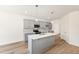 Well-lit kitchen with a large island and sleek appliances at 40 Rosewood Ln, Youngsville, NC 27596