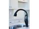 A close-up of a kitchen faucet with sleek design and modern features at 40 Rosewood Ln, Youngsville, NC 27596