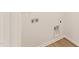 Laundry room featuring wood floors and hookups at 40 Rosewood Ln, Youngsville, NC 27596