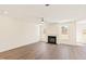 Inviting living room with a fireplace, wood flooring, and natural light at 40 Rosewood Ln, Youngsville, NC 27596