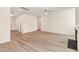 Open living room featuring wood flooring and a fireplace at 40 Rosewood Ln, Youngsville, NC 27596