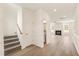 Open concept living space with hardwood floors and a cozy fireplace at 40 Rosewood Ln, Youngsville, NC 27596