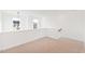 Bright loft area with natural light and carpet flooring at 40 Rosewood Ln, Youngsville, NC 27596