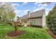 Backyard featuring a deck and a well maintained lawn at 401 Stinhurst Dr, Durham, NC 27713