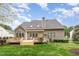 Backyard featuring a deck and a well maintained lawn at 401 Stinhurst Dr, Durham, NC 27713