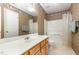 Bathroom with a vanity, toilet, shower, and decorative wallpaper at 401 Stinhurst Dr, Durham, NC 27713