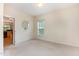 Bedroom with carpet, a window, and an ensuite bathroom entrance at 401 Stinhurst Dr, Durham, NC 27713