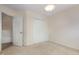 Bedroom featuring neutral carpet, closet, doorway, and light walls at 401 Stinhurst Dr, Durham, NC 27713