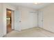 Bedroom featuring a doorway, closet, neutral carpet and white walls at 401 Stinhurst Dr, Durham, NC 27713