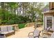 Spacious wooden deck surrounded by lush greenery and trees, perfect for outdoor relaxation at 401 Stinhurst Dr, Durham, NC 27713