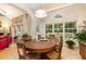 Bright dining room with an oval wood table, six chairs and a view of the back deck at 401 Stinhurst Dr, Durham, NC 27713