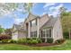 Charming two-story home with manicured landscaping, lush lawn, and an attached garage at 401 Stinhurst Dr, Durham, NC 27713