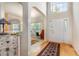 Bright foyer with hardwood floors, high ceilings, and elegant arched doorways at 401 Stinhurst Dr, Durham, NC 27713