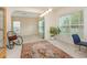 Open living room with carpet flooring, a window, and an arched entry at 401 Stinhurst Dr, Durham, NC 27713