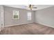 Bedroom with a neutral walls, carpet, and two bright windows at 41 Willow Green Dr, Clayton, NC 27527