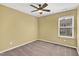 Bedroom with a tan walls, carpet, ceiling fan, and window at 41 Willow Green Dr, Clayton, NC 27527