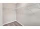 Walk in closet featuring modern rack system and carpeted floor at 41 Willow Green Dr, Clayton, NC 27527