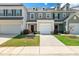 Charming townhomes featuring attached garages, manicured lawns, and varied siding colors for a unique curb appeal at 41 Willow Green Dr, Clayton, NC 27527
