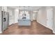 Spacious open-concept kitchen and living area with stainless steel appliances and hardwood flooring throughout at 41 Willow Green Dr, Clayton, NC 27527