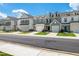 Street view of townhomes featuring well maintained landscaping and neutral colors at 41 Willow Green Dr, Clayton, NC 27527