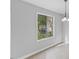 Bright dining area featuring a large window with views of greenery and natural light at 4101 Five Oaks Dr # 40, Durham, NC 27707