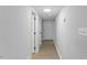 Bright hallway with neutral paint, wood-look flooring and a clear view of the front door at 4101 Five Oaks Dr # 40, Durham, NC 27707