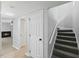 Interior view of the carpeted stairway with a view of the living room fireplace at 4101 Five Oaks Dr # 40, Durham, NC 27707