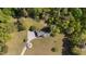 Overhead view of cozy home surrounded by lush greenery on a spacious lot at 413 Bayles Rd, Lillington, NC 27546