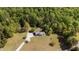 Aerial view of ranch home, long drive, nice landscape and wooded lot at 413 Bayles Rd, Lillington, NC 27546