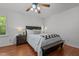 Cozy bedroom featuring a queen bed, nightstand, and ceiling fan at 413 Bayles Rd, Lillington, NC 27546