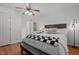 Comfortable bedroom with a queen bed, ceiling fan, and ample natural light at 413 Bayles Rd, Lillington, NC 27546