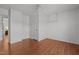 Bright bedroom with light walls, wood-look floors, and a ceiling fan at 413 Bayles Rd, Lillington, NC 27546