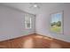 Bedroom featuring neutral walls, laminate wood flooring, and natural light at 413 Bayles Rd, Lillington, NC 27546