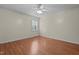 Neutral bedroom with a ceiling fan, laminate floor, and natural light at 413 Bayles Rd, Lillington, NC 27546