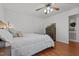 Bright bedroom featuring a bed, dresser, and neutral color palette at 413 Bayles Rd, Lillington, NC 27546