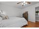 Bedroom with a queen bed, dresser, and bright, neutral walls at 413 Bayles Rd, Lillington, NC 27546