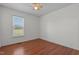 Bedroom with natural light and laminate wood flooring at 413 Bayles Rd, Lillington, NC 27546