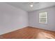 Light-filled bedroom with a ceiling fan and laminate wood flooring at 413 Bayles Rd, Lillington, NC 27546