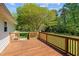 Wooden deck view offering scenic views of the expansive backyard and lush surrounding landscape at 413 Bayles Rd, Lillington, NC 27546